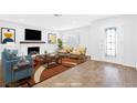 Bright living room with a painted fireplace, hardwood floors, and elegant decor at 3547 Rosewood St, Las Vegas, NV 89103