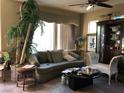 Inviting living room with a comfortable couch, tile floors, and decorative accents at 3601 Pinnate Dr, Las Vegas, NV 89147