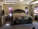 Spacious main bedroom featuring a decorative bed, neutral carpet, and plenty of natural light at 3601 Pinnate Dr, Las Vegas, NV 89147