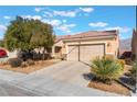 Charming single-story home with a two-car garage and desert landscaping, nestled in a quiet neighborhood at 3608 Herring Gull Ln, North Las Vegas, NV 89084