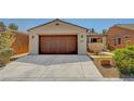Charming single-story home featuring a well-maintained front yard and an attached two-car garage at 3649 Starlight Ranch Ave, North Las Vegas, NV 89081