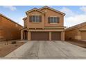 Beautiful two-story home showcasing a three-car garage and appealing neutral exterior at 3718 True Spring Pl, North Las Vegas, NV 89032