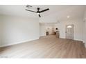 Bright and airy living room boasts modern flooring and leads into an open-concept kitchen at 427 Wright Way, Henderson, NV 89015