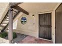 Charming front entrance with an ornate security door and a decorative glass window next to the stairs at 5070 Jeffreys St # 101, Las Vegas, NV 89119