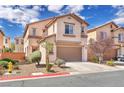 Charming two-story home boasts a lovely, low maintenance front yard and an attached two-car garage at 5351 Glenburnie St, Las Vegas, NV 89122