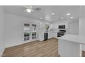 Bright kitchen featuring white cabinets, stainless steel appliances, and a modern aesthetic at 57 Marion Dr, Las Vegas, NV 89110