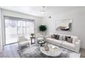 Bright living room with a ceiling fan, slider and modern furnishings at 1405 Vegas Valley Dr # 247, Las Vegas, NV 89169