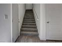 Carpeted staircase with white walls and trim, leading to the upper level of the home at 20 Barbara Ln # 25, Las Vegas, NV 89183