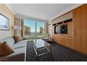 Comfortable living room with a city view and built in cabinets and entertainment center at 2000 N Fashion Show Dr # 3307, Las Vegas, NV 89109