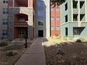 Exterior image of an entrance to a condo building with desert landscaping at 26 E Serene Ave # 412, Las Vegas, NV 89123