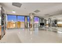 Bright living room with stainless steel appliances and large windows overlooking the vibrant city skyline at 3726 Las Vegas Blvd # 2506, Las Vegas, NV 89158