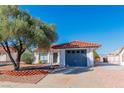 Charming single-story home with a well-maintained front yard and a tile roof at 451 Concord Way, Henderson, NV 89015