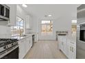Bright kitchen featuring stainless steel appliances, quartz counters and ample cabinet space at 457 Leighann Rd, Henderson, NV 89015