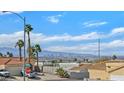 Scenic view of Las Vegas skyline from residential neighborhood with palm trees at 457 Leighann Rd, Henderson, NV 89015