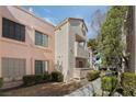 Exterior view of the condo building, showcasing the architecture and surroundings at 4861 S Torrey Pines Dr # 106, Las Vegas, NV 89103