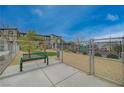 Fenced dog park with bench and waste station, offering a secure area for pet exercise at 542 Foothill Cove Ln, Henderson, NV 89002