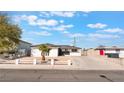 Beautiful single-story home with a low white picket fence and desert landscaping at 6320 Hobart Ave, Las Vegas, NV 89107