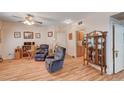 Cozy living room with hardwood floors, comfortable seating, and natural light creates a relaxing atmosphere at 6705 Squaw Mountain Dr # 102, Las Vegas, NV 89130