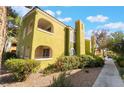 Condo exterior showcases balconies and well-maintained landscaping and private entrances at 7950 W Flamingo Rd # 1037, Las Vegas, NV 89147