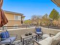 Cozy balcony with comfortable seating and views of the surrounding neighborhood at 817 Peachy Canyon Cir # 204, Las Vegas, NV 89144