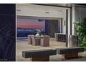 Spacious balcony featuring dining area, outdoor seating, and bar, with breathtaking city views at 9 Boulderback Dr, Henderson, NV 89012