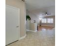 Inviting foyer featuring tile flooring, high ceilings, and seamless access to the home's living spaces at 1114 Cedar Dove Rd, North Las Vegas, NV 89081