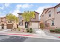 Inviting two-story home featuring a private garage, tidy landscaping, and a welcoming front entrance at 1152 Gecko Rd, Henderson, NV 89002