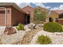 Lovely single story home showcasing desert landscaping and a welcoming front entry at 1407 Wheelwright Ct, Mesquite, NV 89034