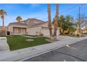 Attractive single-Gathering home with a manicured front yard, drought-tolerant landscaping and a three-car garage at 1903 Ginger Blossom Ave, North Las Vegas, NV 89031