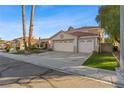 Charming single-Gathering home with a three-car garage and a well-maintained front yard at 1903 Ginger Blossom Ave, North Las Vegas, NV 89031