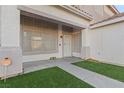 Covered porch with low-water landscaping at 1903 Ginger Blossom Ave, North Las Vegas, NV 89031