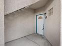 A secure exterior entrance featuring a solid white door with a decorative glass window at 2251 Wigwam Pkwy # 314, Henderson, NV 89074