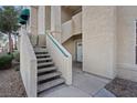 Building exterior featuring stairs and an entry door in a low-maintenance desert landscape at 2251 Wigwam Pkwy # 314, Henderson, NV 89074