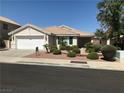 Charming single-story home featuring a two-car garage and desert landscaping at 331 Mount Hope St, Henderson, NV 89014