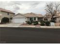 Inviting single-story home featuring a two-car garage and low-maintenance desert landscaping at 331 Mount Hope St, Henderson, NV 89014