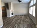 Bright living room with high ceilings, wood flooring, and fireplace feature at 331 Mount Hope St, Henderson, NV 89014