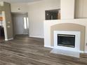 Inviting living room featuring hardwood flooring and a cozy fireplace at 331 Mount Hope St, Henderson, NV 89014