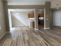Spacious living room featuring open layout, wood-look floors, and natural light at 331 Mount Hope St, Henderson, NV 89014