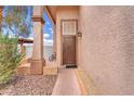 Inviting entryway with a secure front door, brick accents, and a well-maintained landscape at 3536 Golden Pedal St, Las Vegas, NV 89129