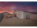 An outdoor patio area with patio furniture, a rock yard, string lights and a block wall at 4315 E Cactus Canyon Dr, Pahrump, NV 89061