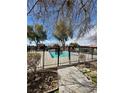 Community pool enclosed by a black metal fence in a neighborhood at 5083 Village Dr, Las Vegas, NV 89142