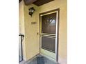 Close-up of the front door showing the house number and light fixture at 5083 Village Dr, Las Vegas, NV 89142