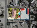 Aerial view of property with pool and accessory structures with expansive side lot at 5340 N Campbell Rd, Las Vegas, NV 89149