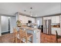 Open concept kitchen with granite countertops, stainless steel appliances, and breakfast bar at 6709 Rancho Santa Fe Dr, Las Vegas, NV 89130