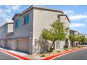 View of the side of a two-story home with street parking and clean landscaping at 760 Crisp Morning Ct, North Las Vegas, NV 89086