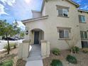 Inviting home with a covered entryway and well-maintained front yard landscaping, perfect for relaxing outdoors at 760 Crisp Morning Ct, North Las Vegas, NV 89086