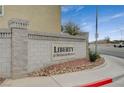 Stone community sign that reads Liberty at Silverado Ranch with desert landscaping at 10265 Franford Ct, Las Vegas, NV 89183