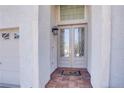 Elegant front door with glass panels and a welcoming 'hello' mat at 12 Cascade Lake St, Las Vegas, NV 89148
