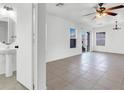 Bright and spacious living room featuring tile floors and backyard access at 1203 Sweet Orange St, Las Vegas, NV 89142