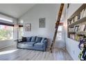 Living room with high ceilings and large bookshelves with ladder at 182 Cantamar St, Henderson, NV 89074